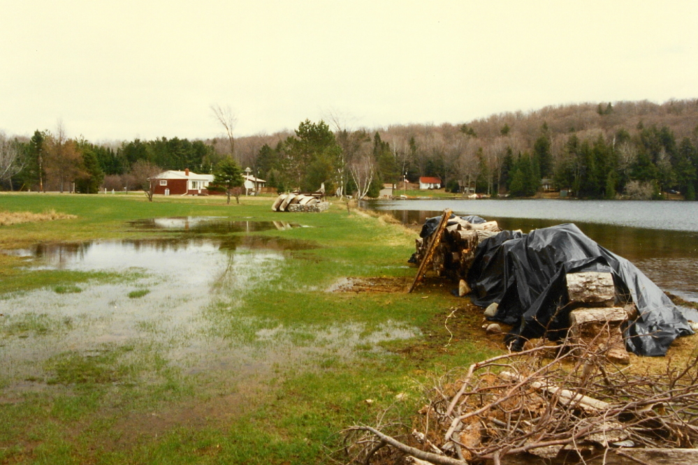 The quick melt of all the snow has pushed the lake up past the beach on the North end.