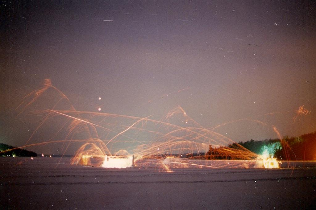 The pictures lie. A ten minute exposure makes it look like quite a melee, but there was rarely more than two rockets in the air at the same time.