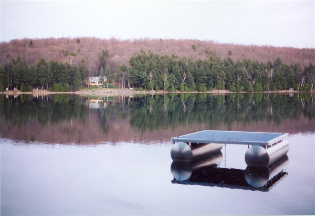 The last of the ice left the lake 26 days ago. Leaves and swim-able water are about 6 weeks away. Lake Lucerne is in the between time. It is not a good time for skiing, swimming, or Rafto, but it's a great time to take care of light Spring tasks.