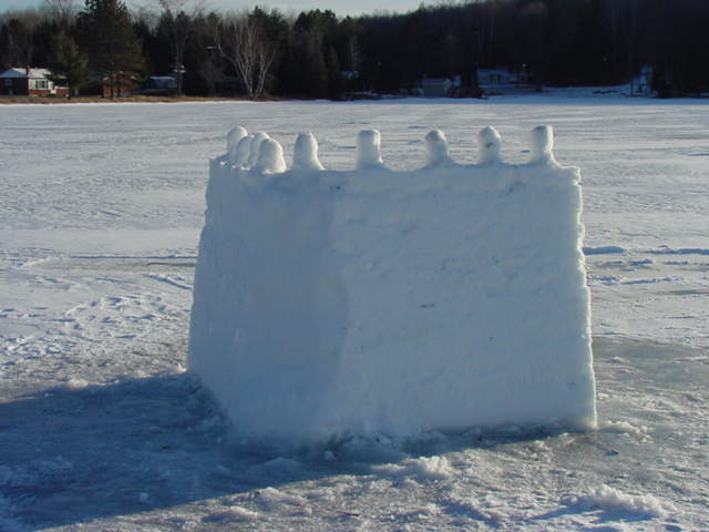 Jeff's fort had interesting little snow things on the top.  They were equally spaced and of uniform size for the most part.  There were 9 of them.  The second one from the left was struck during the war.