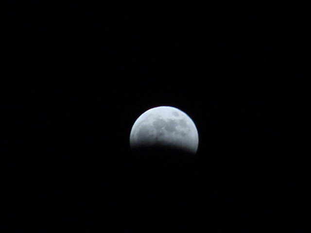 In about 45 minutes almost half the moon was in shadow.  At about this time some loons on the lake started to get really noisy.