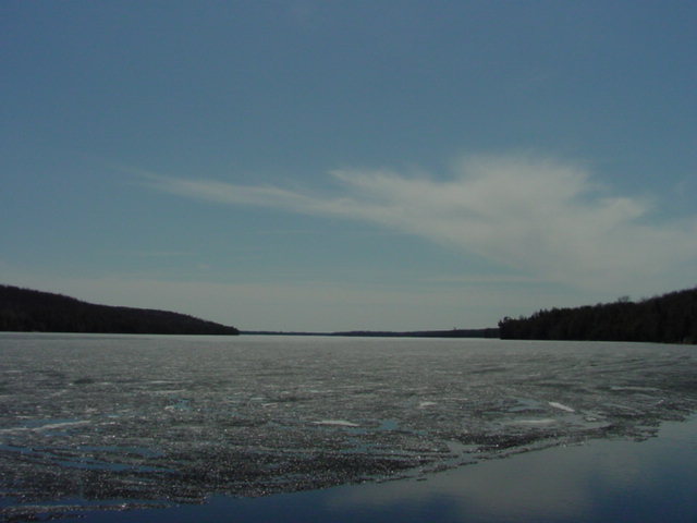 The skies started to cloud up when we left.  Heavy rain would pelt the lake ice that night and strong winds will further reduce it on Sunday.  Ice-out could be any day now.  We now have  DSL! The webcam updates every 5 minutes and the weather will soon be "live".  We'll be back next week.<br><br><br>-Nemo