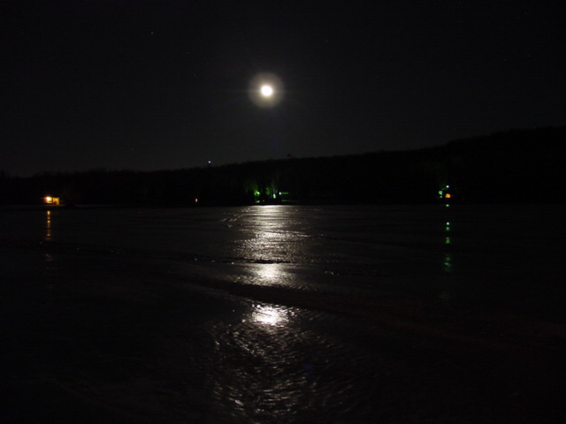 We carved a 5 by 6 foot hole in the ice by moonlight and, by mid-night, the desire to get the last/first swim of the year left us.  No one took the plunge.  Maybe next year...