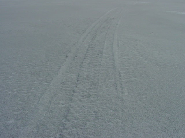 A few snowmobile tracks traverse the north end of the lake.