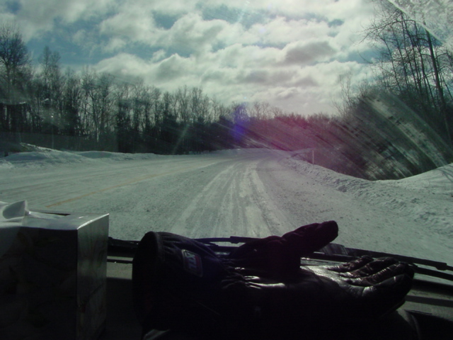 We had to leave at noon.  The roads in forest county were great.  You could see the pavement.  After Forest county they were worse.  This is Hwy 32 near Suring. Note the lack of a center line and no defined edge.  Highway speeds were maintained only by the foolish or crazy.