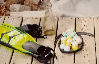 Treasures pulled from the deep included some litter, golfballs, and an old 1 quart milk bottle.