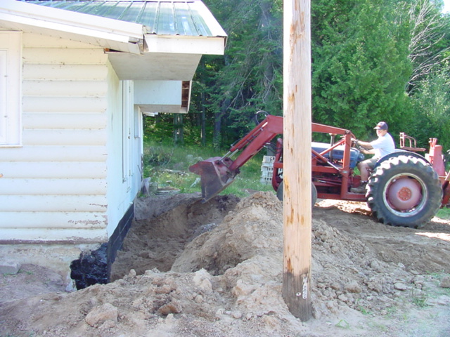 Saturday morning was spent backfilling a rebuilt wall on Planet's Bar.  The blue and red machine seen here made the job much easier then using shovels and backs.  Less painful too.