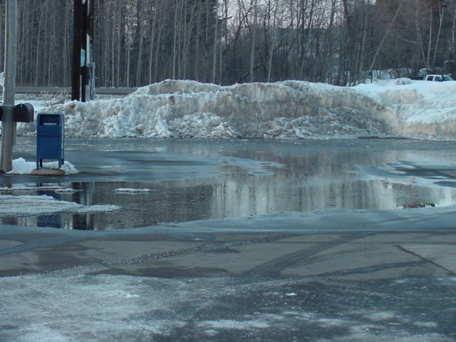 The body of water in front of the Liquor Lode is getting pretty deep.  There are rumors that divers had to pull a car out after the driver foolishly used the mailbox.  Talk is that the DNR will be stocking it soon with many species of fish including musky.