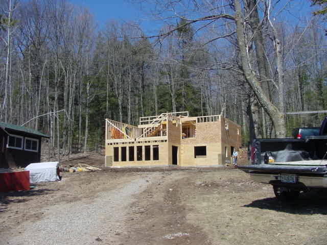 The sound of hammers and saws fills the otherwise still air of the north end of the lake.