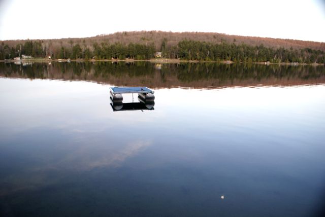 The lake on Saturday evening was a sheet of unskied glass.  The east shore hill should be greening up in the next few weeks.
