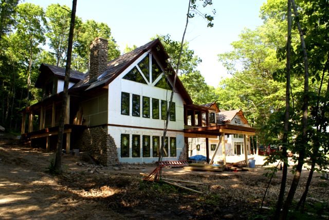 The western house seems to be moving faster.  The deck bud has grown into a covered room and sprouted it's own deck.  A western driveway has appeared.