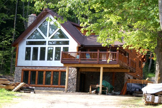 The western house looks closer to done as indicated by the chairs on the deck.