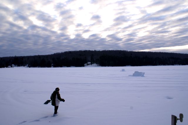 The snow is deep on the lake with a 2 to 3 inch slush layer just above the ice.  Trudging out to find a spot to drill a hole was slow going.