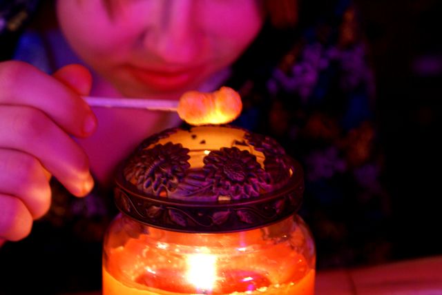 On Saturday night, teen types wanted to roast marshmallows over a campfire.  We didn't have marshmallows, sticks, or a campfire but we did have cheese puffs, golf tees, and a candle.