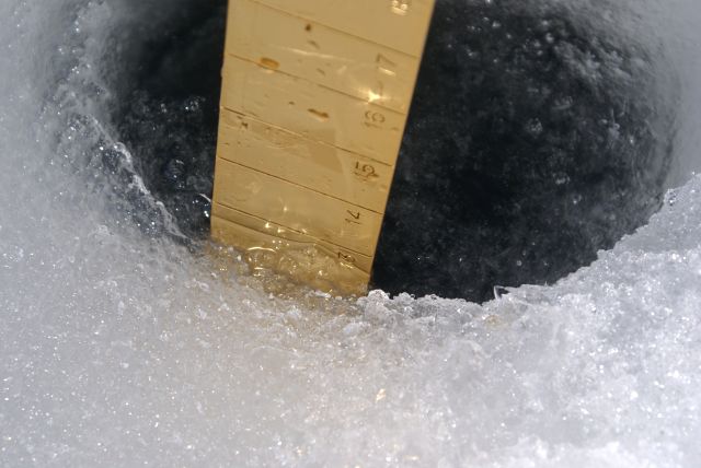 At about 20 feet from shore the ice was 13 inches thick.  Further out it was 16 inches thick.