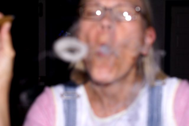 Then cigars.  A CD case featuring some long haired guy playing new-age music was found.  Reading the insert, it was further discovered that he plays the recorder...professionally.  At this news the crowd became enraged and demanded action.  Someone noticed the dartboard...