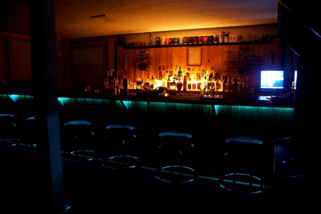 Cool blue lights were added the previous night to the underside of the bar.  The hunters seemed largely unimpressed by the loungy glow.  The night started innocently enough with many banana daiquiris.  Then came the beer.  Then came a bizarre Wild Turkey taste test (Wild Turkey tastes of death).  Then some miscreant found the dice cup.  Then, regrettably, came the tequila.  The cheap tequila  Then came the end.