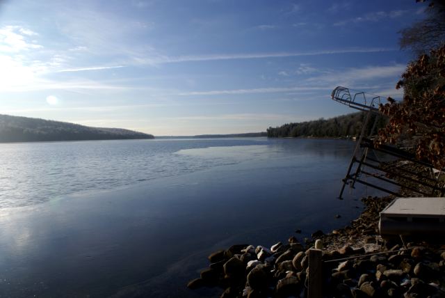 The ice on the shore of the NW corner crept out further than the east shore.  The sun and waves broke it up by lake noon.