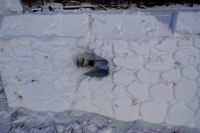 It's a good thing we added the sloped extension to the top of the north wall. Note the stick just above the firing port.