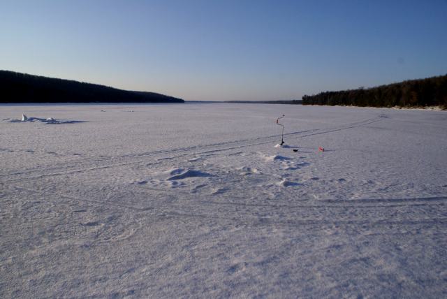 The lake is still frozen.  A hole was drilled on Sunday.  The ice is 22.5 inches thick.  That number should be lower next weekend with all the warm weather predicted this week.  We'll be back next weekend to get a measurement.<br><br><br>-Nemo