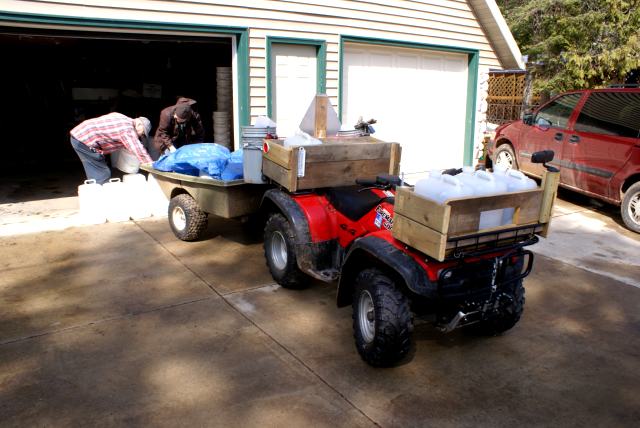 Late Saturday morning, it was time to load the ATV and trailer with jugs to be filled with fresh tree squeezings.