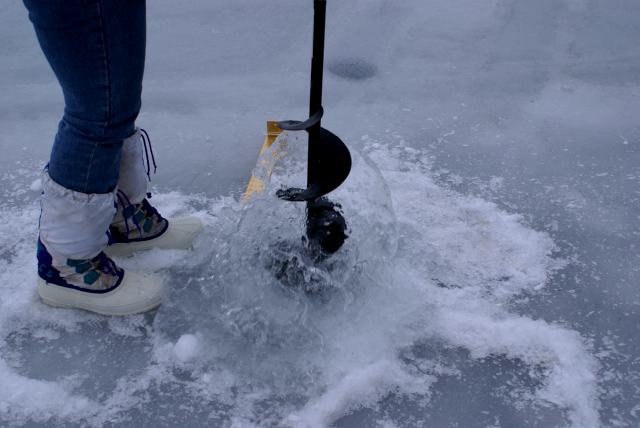 Checking the ice thickness was not an easy task.  There was no snow on the surface and it was really, really slippery.