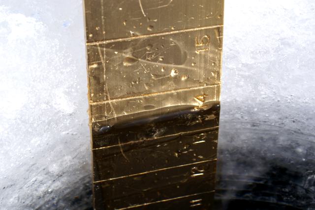 There is just over 14 inches on the lake.  The top 2 inches is the airy kind.  The bottom 12 inches is the solid kind.
