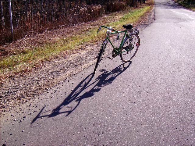 Made it to the northwoods late on Thursday.  The moon was dancing light on the surface of the lake and I was too lazy to try to get a picture of it.  Did penance for my sloth by biking around the lake late Friday morning.  Check out the almost noon shadow.
