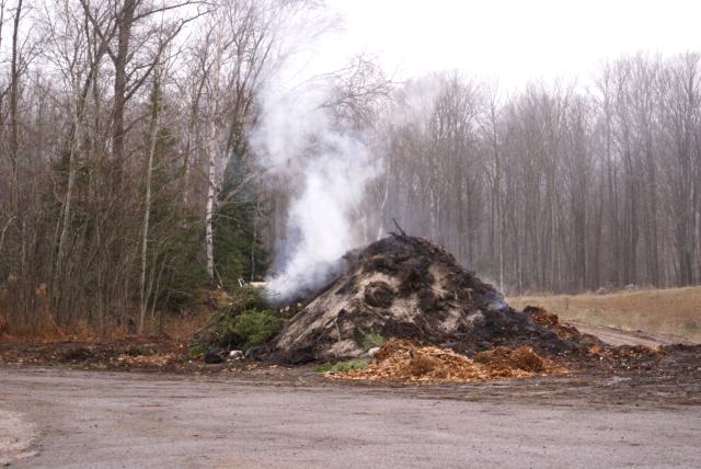 At the dump, the large pile of brush that was growing all Summer/Fall was smoldering down.