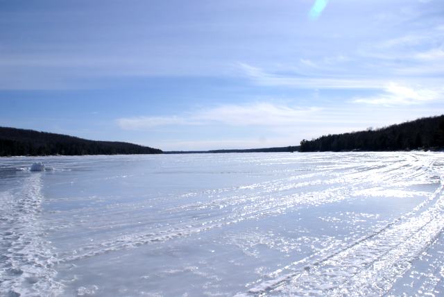 It was depressing to see how little winter's snow seemed to bring the lake level back up.  Looks like it may be slightly lower than late last Fall.  I was told that much of the winter's water is still frozen on the watershed.  Maybe.  We really need a wet Spring (Summer, Fall, Winter).  Be sure to check off the "Rain for the Northwoods" box on your taxes this year.  We saw over a dozen cars spun out (and one in the act of spinning out) on I43 on our way back.  Remember, winter is sane driving season (well, all seasons should be sane driving seasons but especially winter).<br><br><br>-Nemo noticed that the 5th tee was snow free.