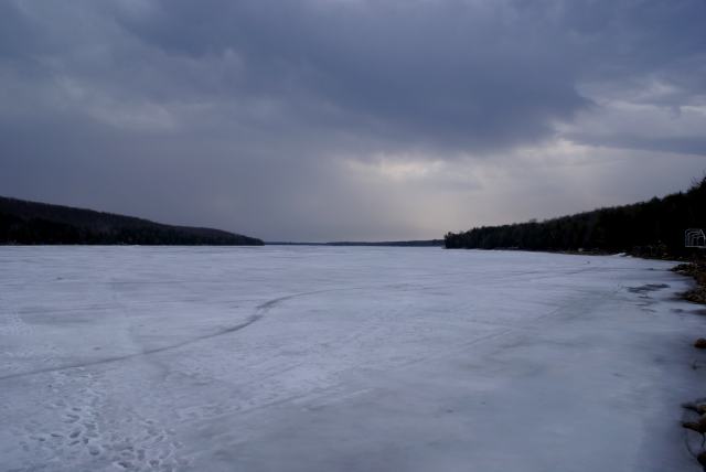 By early Sunday afternoon, the ice was just starting to pull away from the shore.  We left.  Five hours later, the UPS that powers the internet connection to the webcam began to scream.  The lone tapper left at the cabin endured the high pitched, un-beautiful sound for just over an hour before he called.  The sound was ended but it took the webcam's connectivity with it.  We'll get it back up by Friday, long before the ice is unsafe to golf on.  Streams swollen with snow melt, flowed into the lake from all shores all weekend.  A lake level measurement should be possible next weekend.<br><br><br>-Nemo no longer gots your nose, he lost it sometime during the 4:30 AM firing. Sorry.