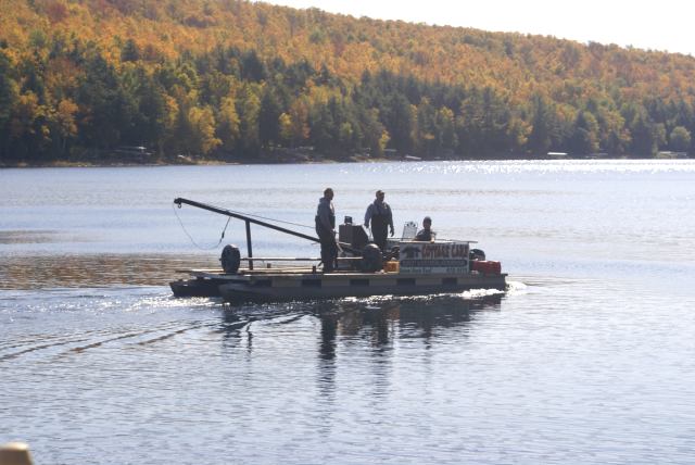 The pontoon-crane guys were muscling piers and lifts from the 60°F water on Sunday.