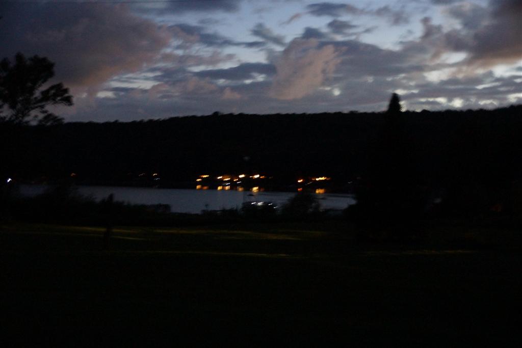 As the sun dipped below the horizion, cabin lights and fires flickered on all around the lake.  The air grew colder as Fall tagged Summer with a few combinations and I can't be sure, but I think Summer got cut.