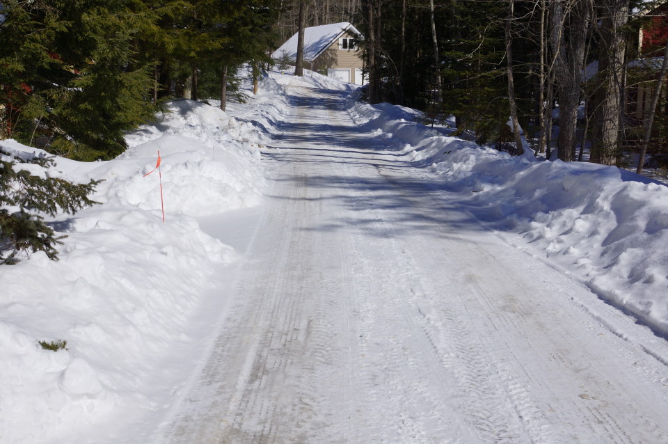 At first glance, Knott Lane looks good.  It's plowed.  If you look a little closer you'll see a 3 to 4 inch layer of ice covering the road's surface.  It can be quite slide-y.