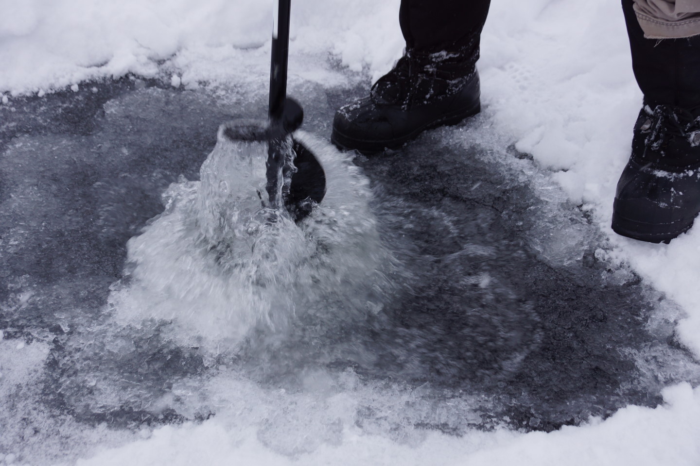 Some of the lake fez was pulled back and a hole was drilled to check the ice quality and thickness.