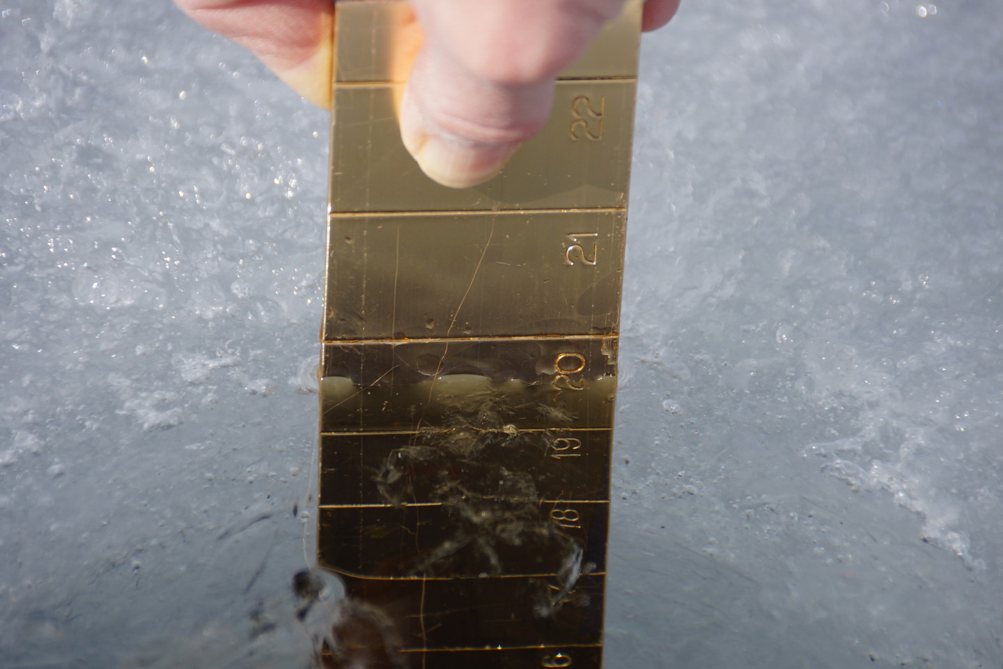 By the end of the week the ice covering Lake Lucerne was thicker than last week.  The twenty inches can be divided into two regions.  There's six inches of airy top ice and 14 inches of clear, hard ice under that.