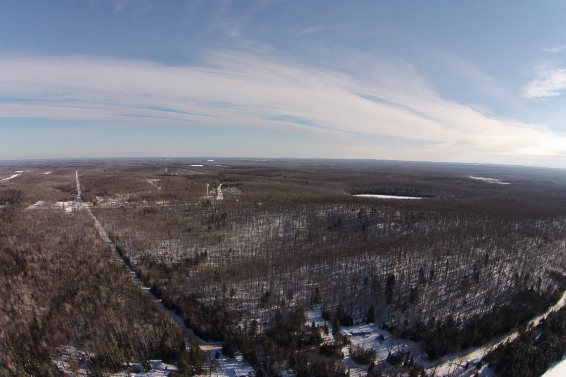 Looking to the East, it appears that Devils Lake is still frozen, as is Wabikon.
