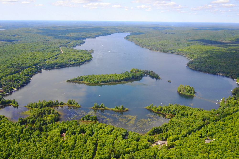 Last week was not just bracketed by storms, but also had rain in the middle. Roofs were made damper and the lake 2.5 inches deeper. If the lake continues to rise at this rate, next Spring's lake ice will be scouring docks, fire pits, and a few cabins from the shore. Our advice would be to enjoy seeing the islands now before they become just other bottom features.<br><br><br>-Nemo didn't ski between the buoys.