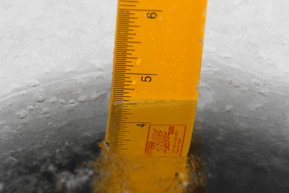 A hole in Lucerne.<br>The first lake ice thickness check.<br>Over five inches.