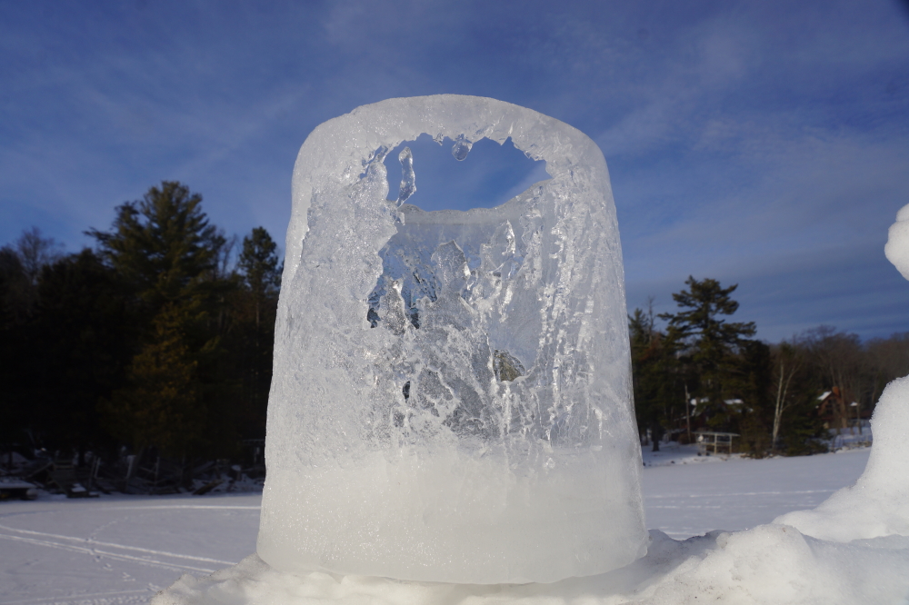 The sun facing side of the ice votives grew thinner. Then lacy. Then gone.