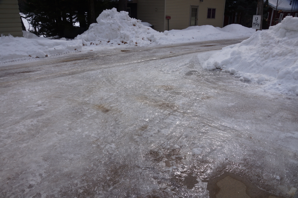 The thaw-by-day, hard-freeze-by-night nature of the weather has created a thick, bruising ice layer on top of Knott Lane. This is probably the main reason that the O'Keefe Triathlon in not held during the month of March.