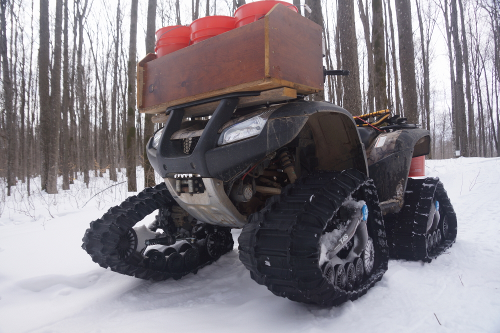 Deep snow makes tapping season interesting. Fortunately, the days of sleds and cursing have been replaced by the ATV with  feet (and cursing). By week's end, all the trees that were planned to be tapped were tapped (360). The sap did run a bit. It's currently frozen in 2 to 6 inch pucks out in the woods. Cooking that ice down will begin around St. Patrick's Day.