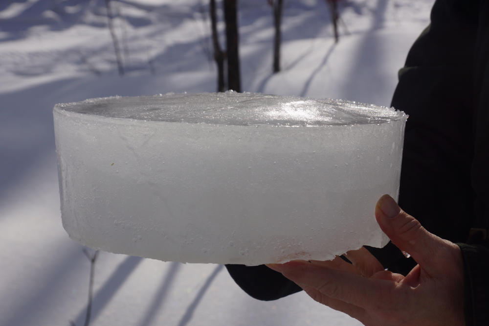 The cold was not as compliant. The modest runs during the day paired with a few single digit nights filled the buckets with pucks of sap ice.