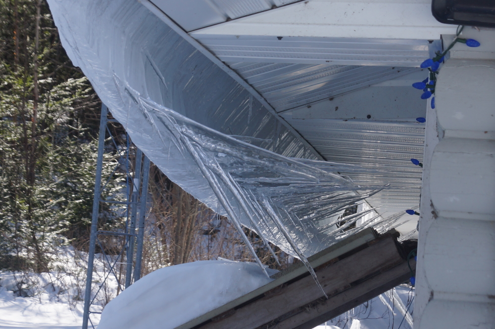 The metal roof of the bar took those impressive icicles and bent them into a cold art piece. Due to the transitory medium the roof chose to create its piece, we'll be scheduling a showing soon. It'll probably be gone by July. Probably.