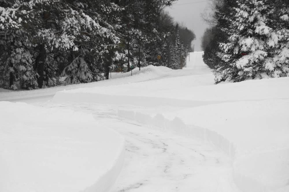 By Sunday evening it stopped enough to begin clearing operations. Some of the more dreadful drifts cleared the top of snowblowers.