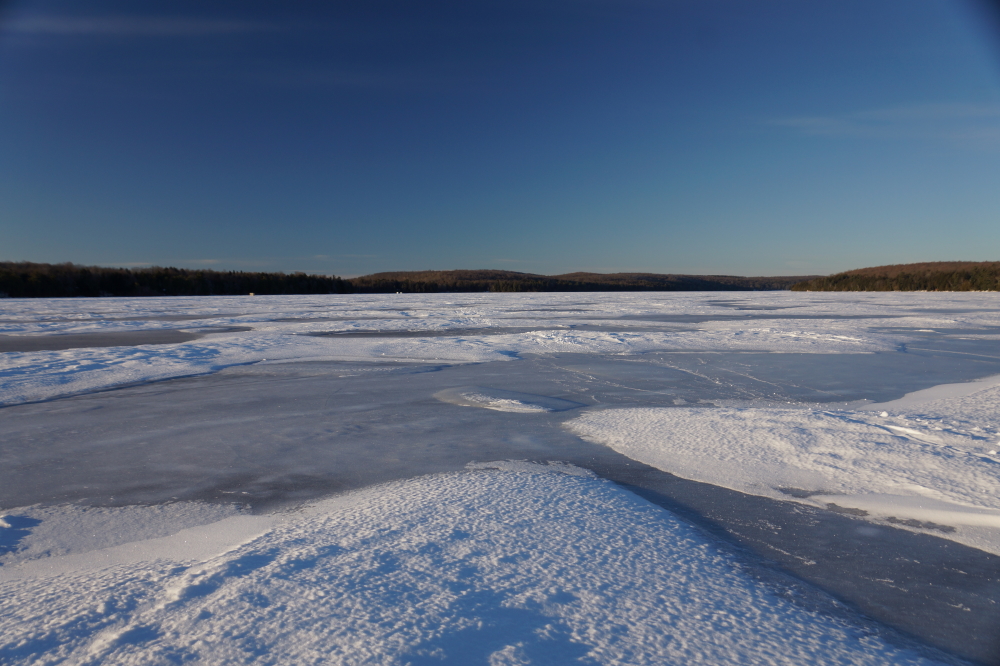 With the exception of the East shore, the South end of the lake has some of the worst conditions for snowmobiling in Wisconsin. The almost frictionless ice is dotted with drifts of snow. Transversing this area with any kind of speed is a bucking, fishtailing horror.