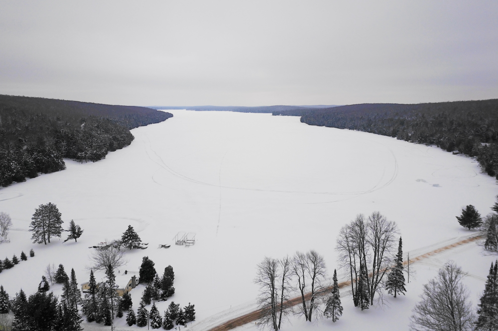 The lake did not get snowed upon last week, but the storms from weeks past continue to cover the area like a quilt of deep cold. The stuff on the roads has been compressed, becoming more like a sheet of ice.