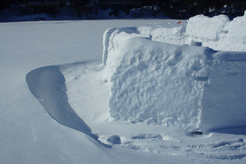 The wind ended up building impressive drifts around anything sticking up above the lake ice.