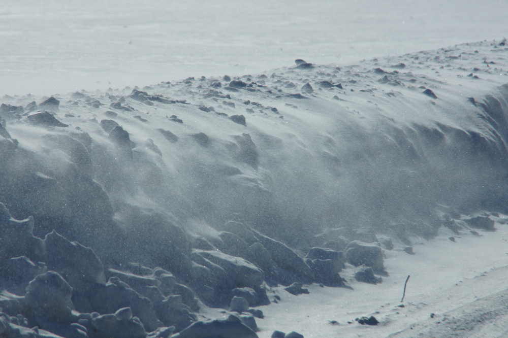 The arctic cold which kept the forts frozen came with strong, gusty winds that took snow off the flats and dumped it on the roads and hollows.