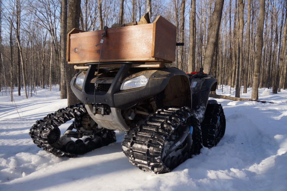 The deep snow in the woods has divided ATVs into two groups: The Tracked and The Stuck.